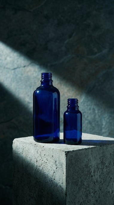 Essential oil bottle in glossy navy, pair one tall one short