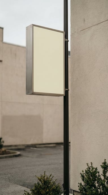 Pylon sign on a tall pole on a clean plaster wall