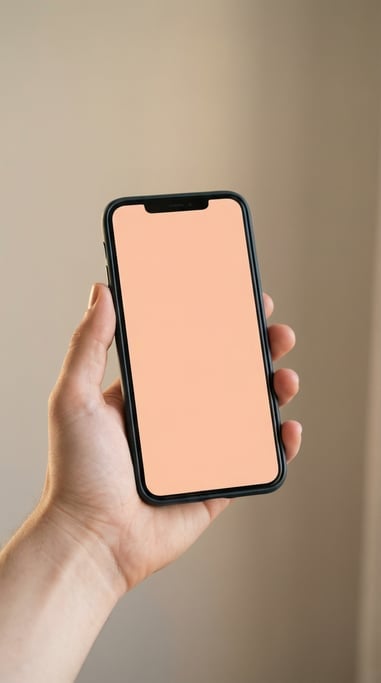 Hand holding a smartphone against a soft blurred beige background
