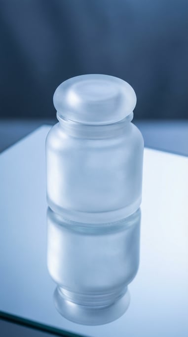 Small round jar in frosted clear, single with reflection below