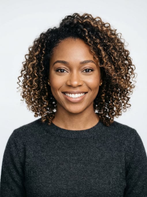 Professional studio headshot of a 26-year-old Nigerian woman with a textured lob with balayage highl