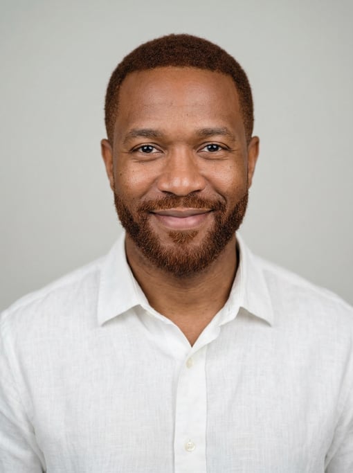 Professional studio headshot of a 40-year-old Black American man with short auburn hair