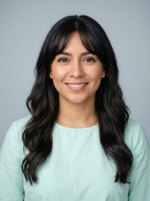 Professional studio headshot of a 28-year-old Latina woman with curtain bangs with long dark hair