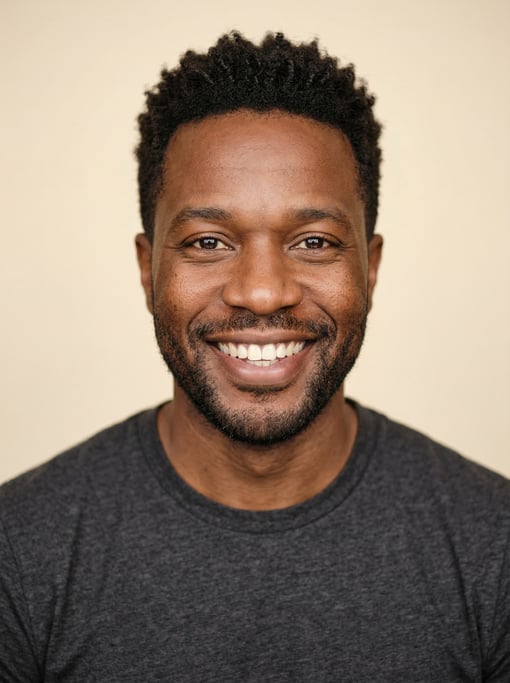 Professional studio headshot of a 39-year-old Black American man with a dark brown textured crop