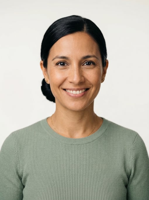 Professional studio headshot of a 35-year-old Argentinian woman with a sleek low bun in black
