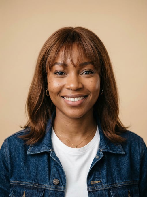 Professional studio headshot of a 24-year-old Black African woman with wispy bangs with a long bob i