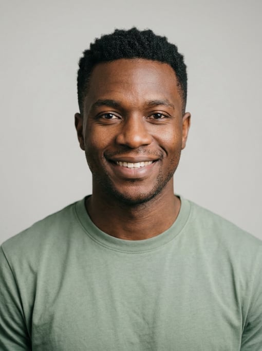 Professional studio headshot of a 27-year-old Black African man with a black textured crop