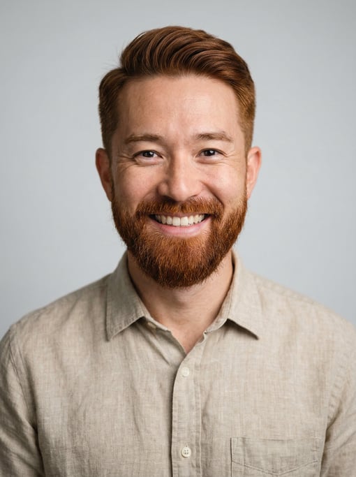 Professional studio headshot of a 40-year-old Japanese man with short red-brown hair