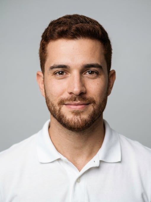 Professional studio headshot of a 27-year-old Brazilian man with short red-brown hair