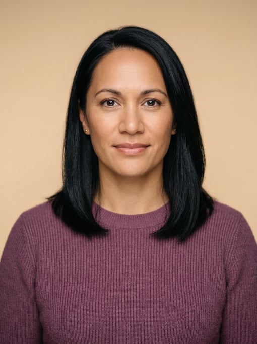 Professional studio headshot of a 39-year-old Maori woman with shoulder-length straight black hair