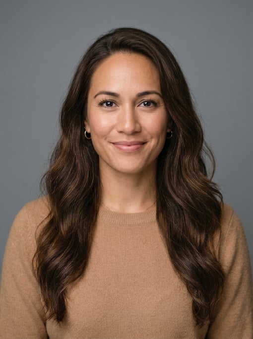 Professional studio headshot of a 31-year-old Hawaiian woman with long wavy dark brown hair
