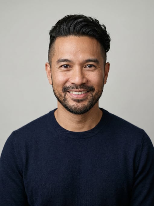 Professional studio headshot of a 40-year-old Thai man with an undercut with longer textured top