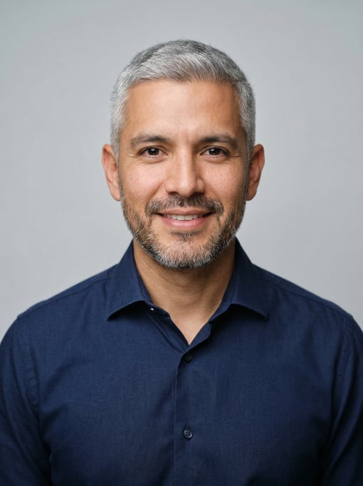 Professional studio headshot of a 32-year-old Mexican man with fully grey short cropped hair