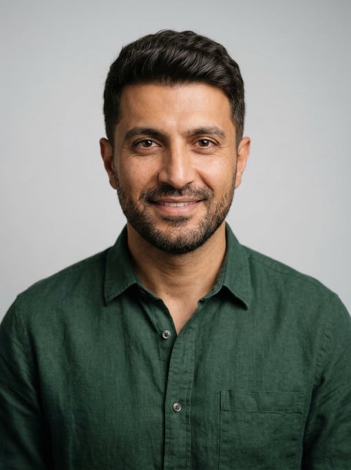 Professional studio headshot of a 40-year-old Persian man with a French crop in dark brown