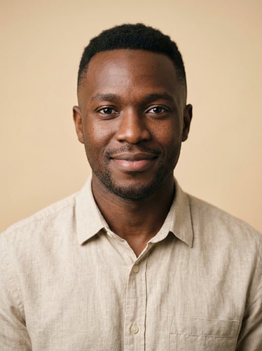 Professional studio headshot of a 29-year-old East African man with a short clean fade