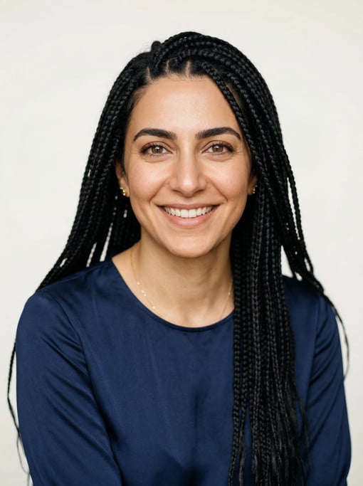 Professional studio headshot of a 33-year-old Persian woman with long box braids in black