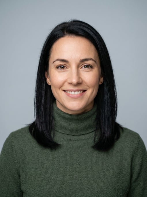 Professional studio headshot of a 31-year-old White European woman with shoulder-length straight bla