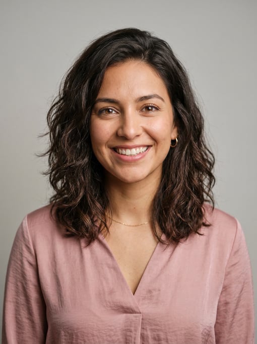 Professional studio headshot of a 25-year-old Latina woman with a textured lob in dark brown