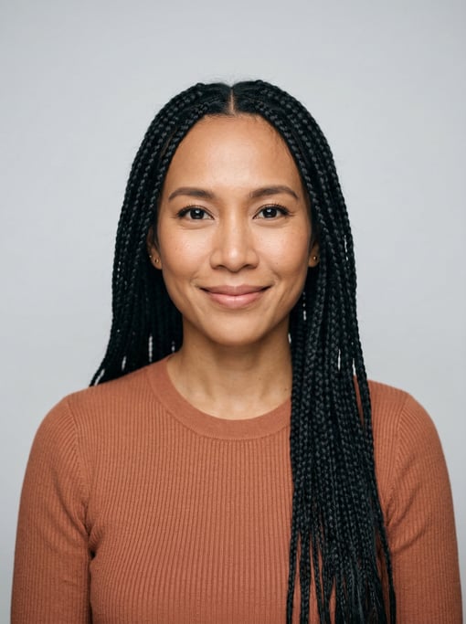 Professional studio headshot of a 35-year-old Thai woman with long box braids in black