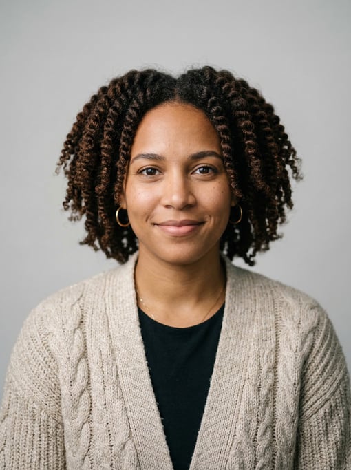Professional studio headshot of a 26-year-old Puerto Rican woman with twist-outs in dark brown
