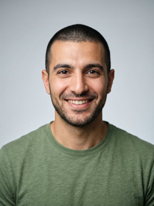 Professional studio headshot of a 30-year-old Lebanese man with a buzz cut in black