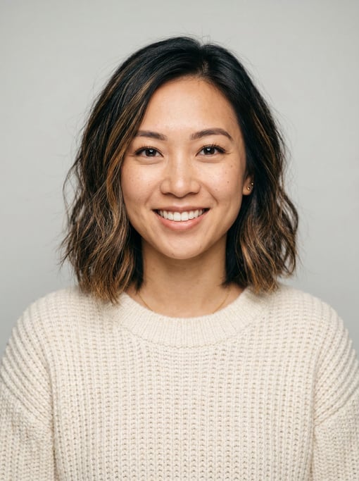 Professional studio headshot of a 25-year-old Vietnamese woman with a textured lob with balayage hig