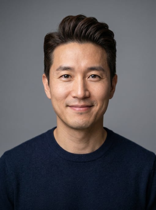 Professional studio headshot of a 39-year-old Korean man with a pompadour in dark brown