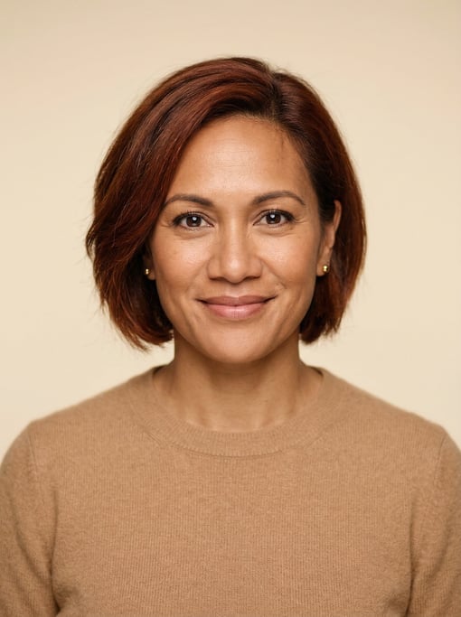 Professional studio headshot of a 40-year-old Polynesian woman with a chin-length bob in auburn