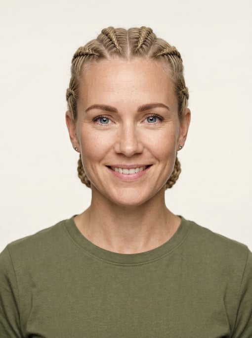 Professional studio headshot of a 35-year-old White Nordic woman with cornrows pulled back neatly