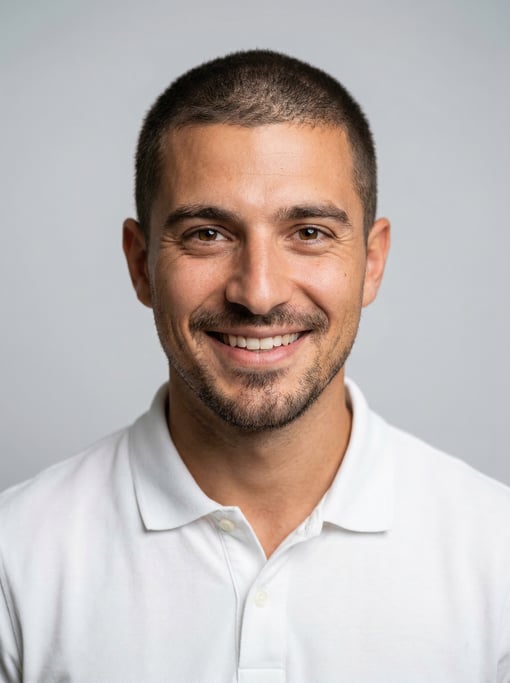 Professional studio headshot of a 27-year-old White Mediterranean man with a buzz cut in brown