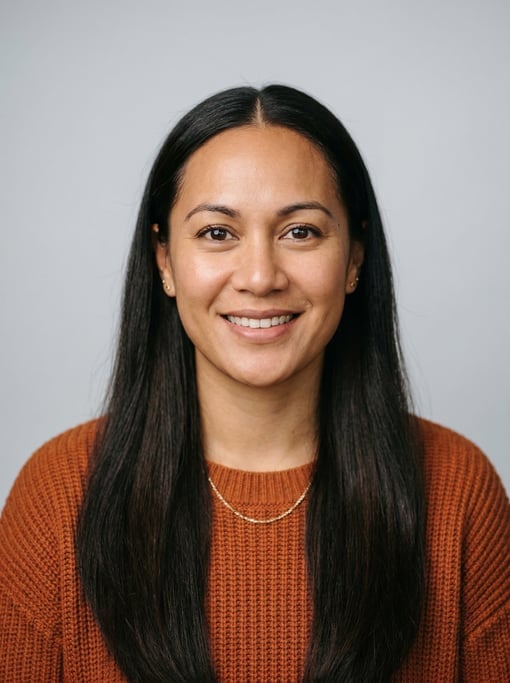 Professional studio headshot of a 31-year-old Pacific Islander woman with long straight dark brown h