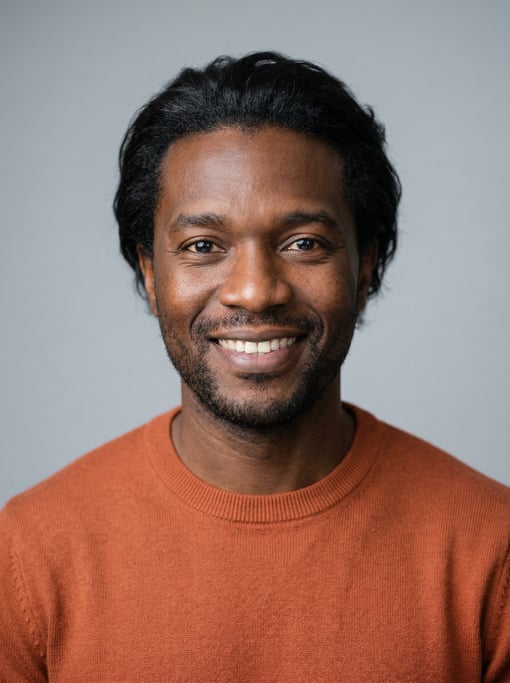 Professional studio headshot of a 39-year-old Black African man with medium-length wavy black hair s