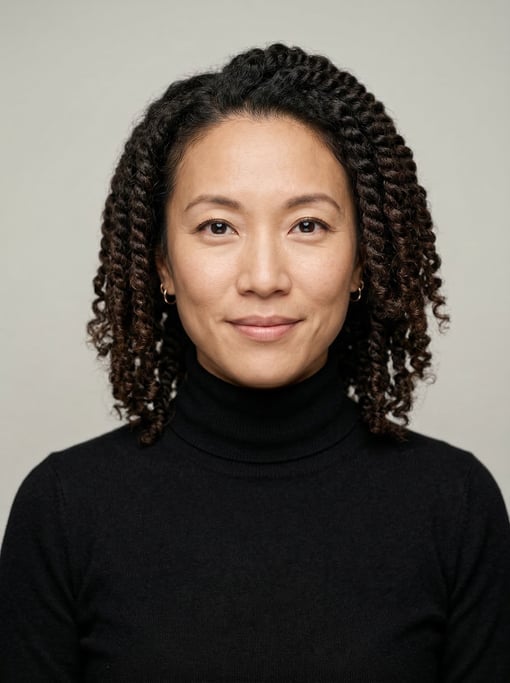 Professional studio headshot of a 37-year-old East Asian woman with twist-outs in dark brown