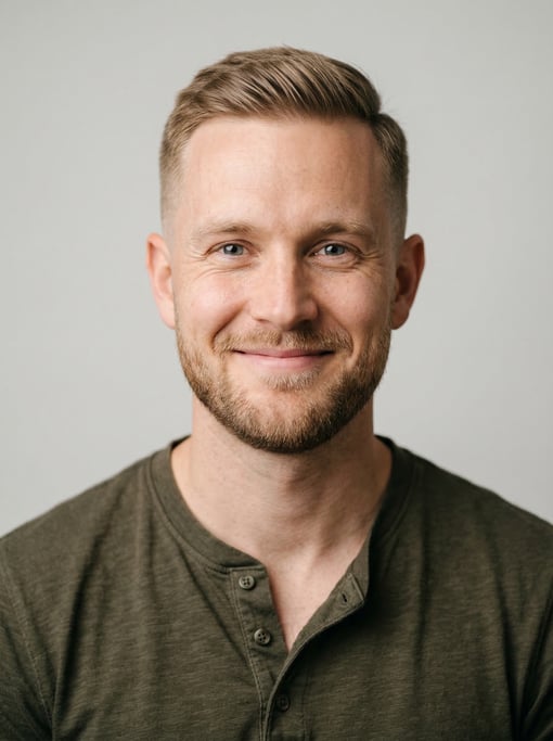 Professional studio headshot of a 28-year-old White Nordic man with a short clean fade