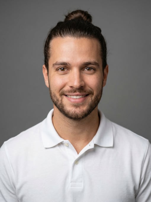 Professional studio headshot of a 25-year-old Brazilian man with a man bun in dark brown
