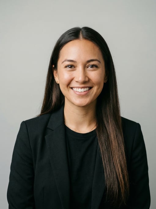 Professional studio headshot of a 28-year-old Hawaiian woman with long straight dark brown hair with