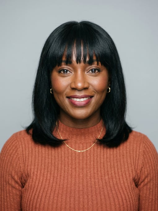 Professional studio headshot of a 35-year-old Ghanaian woman with blunt bangs with shoulder-length b