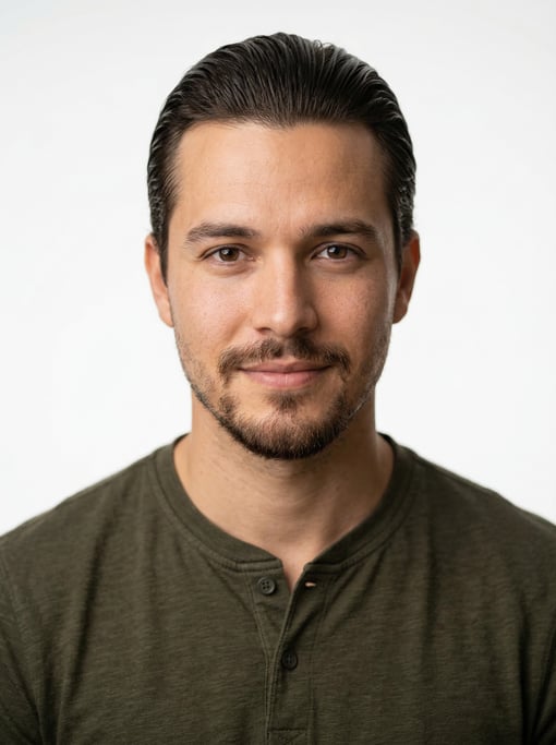 Professional studio headshot of a 27-year-old Brazilian man with a slicked-back style in dark brown