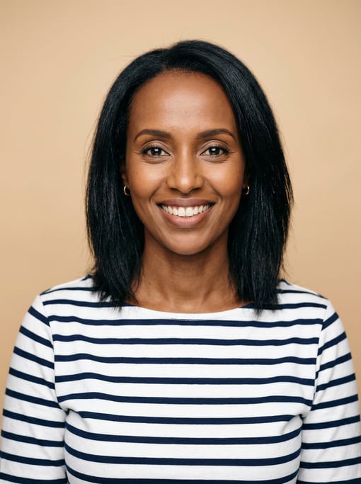 Professional studio headshot of a 39-year-old East African woman with shoulder-length straight black