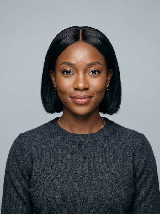 Professional studio headshot of a 28-year-old Ghanaian woman with a blunt bob in jet black with a mi