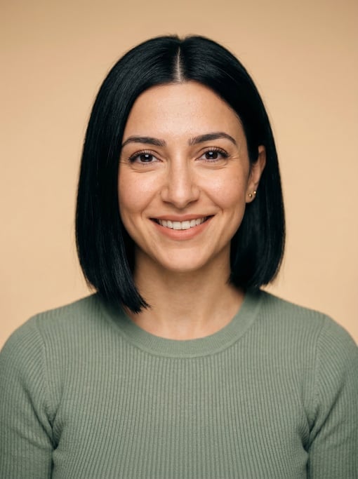 Professional studio headshot of a 28-year-old Lebanese woman with a blunt bob in jet black with a mi