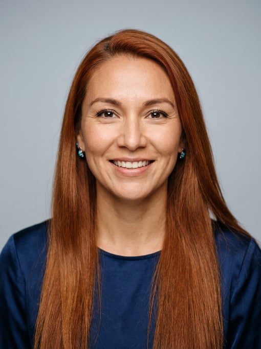 Professional studio headshot of a 37-year-old Native American woman with long straight copper red ha