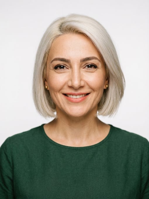 Professional studio headshot of a 40-year-old Persian woman with a blunt bob in platinum blonde