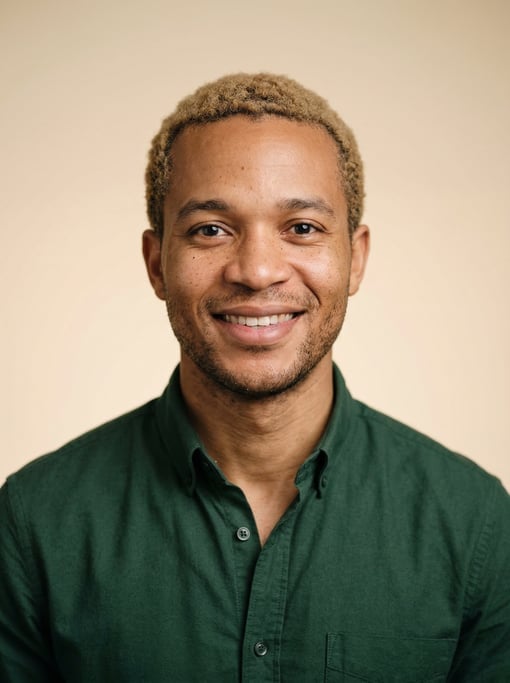 Professional studio headshot of a 29-year-old Ghanaian man with short dirty blonde hair