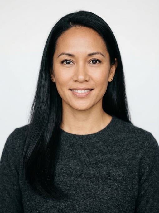 Professional studio headshot of a 39-year-old Hawaiian woman with long straight black hair falling p