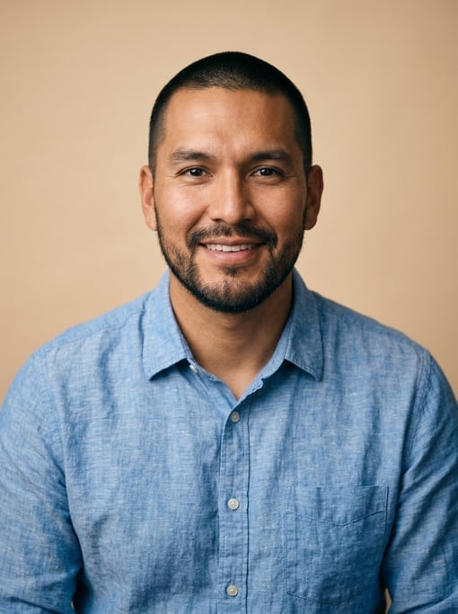 Professional studio headshot of a 35-year-old Native American man with a buzz cut in black