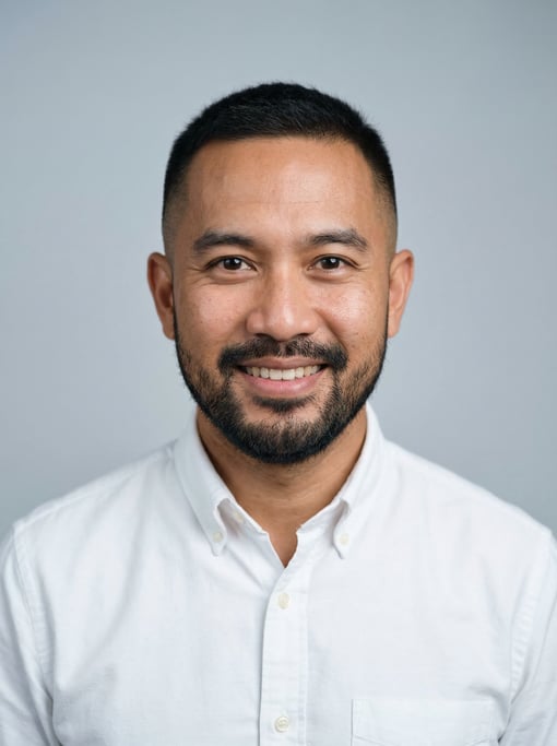 Professional studio headshot of a 38-year-old Thai man with a short clean fade