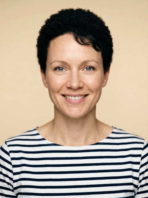 Professional studio headshot of a 36-year-old White Nordic woman with a short TWA hairstyle in black