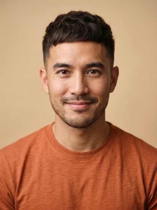 Professional studio headshot of a 30-year-old Thai man with a French crop in dark brown