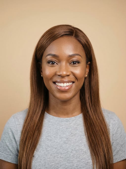 Professional studio headshot of a 34-year-old Black African woman with long straight chestnut hair